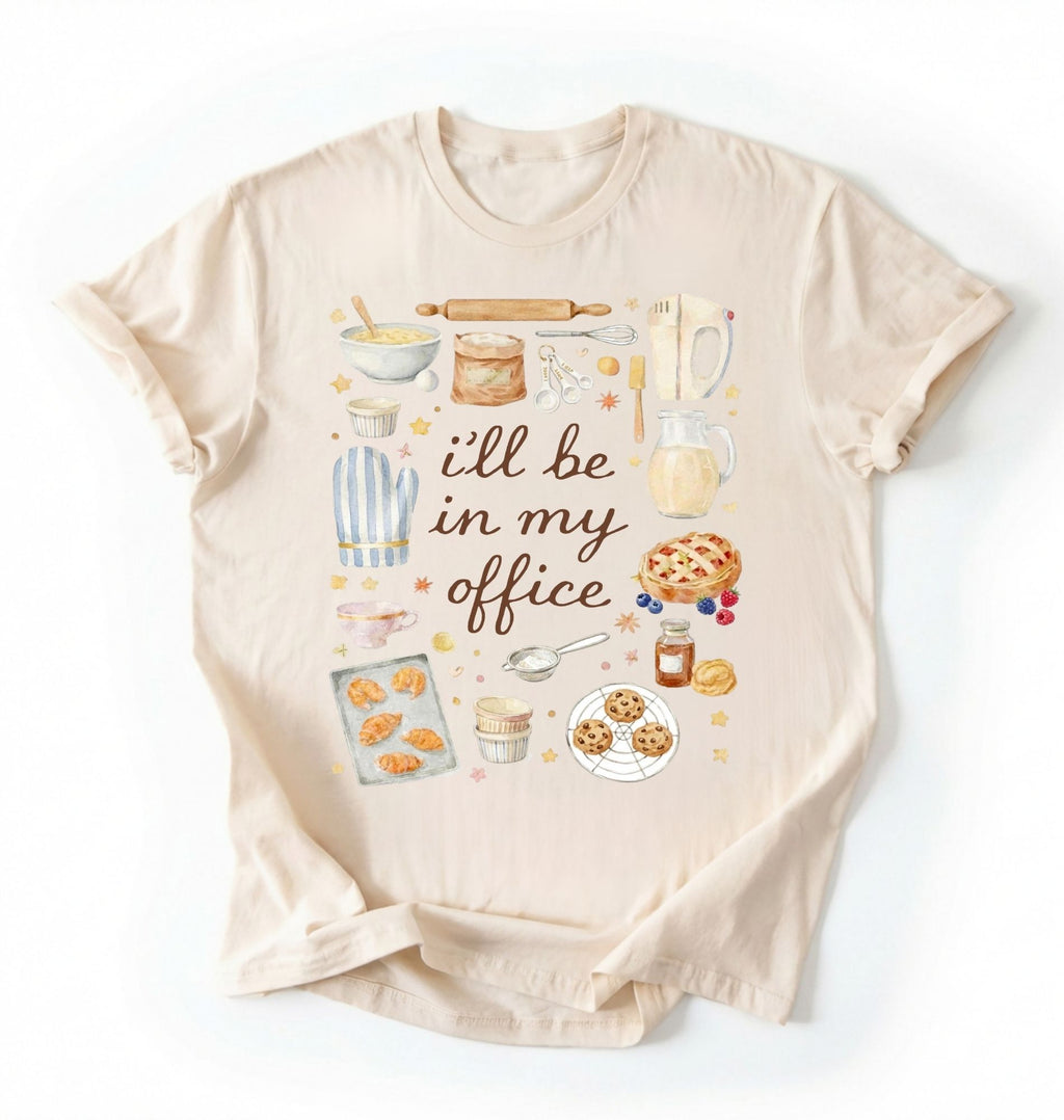 Flat lay of a natural Baking shirt with tools and desserts saying ill be in my office perfect gift for bakers and home baking lovers on a white background