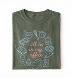 Flat lay of a Funny baking shirt with bread pie cupcake and baking tools illustration on green tee on a white background 