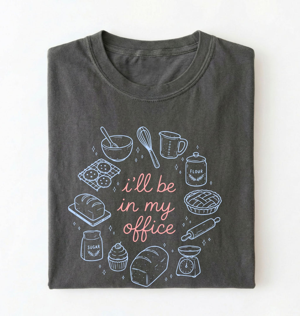 Flat lay of a Funny baking shirt with bread pie cupcake and baking tools illustration on pepper tee on a white background 