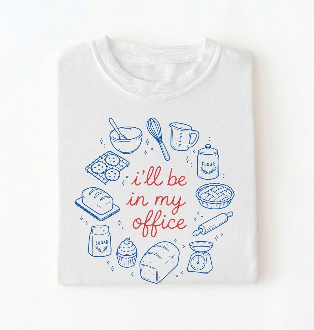 Flat lay of a Funny baking shirt with bread pie cupcake and baking tools illustration on white tee on a white background 