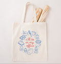 Reusable canvas tote featuring bread, baking ingredients, and kitchen tools