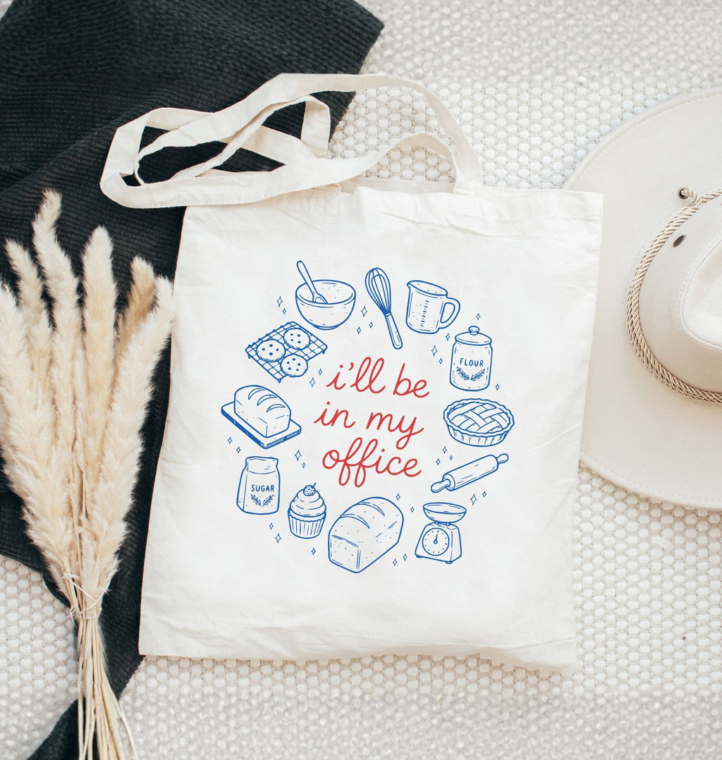 Reusable canvas tote featuring bread, baking ingredients, and kitchen tools