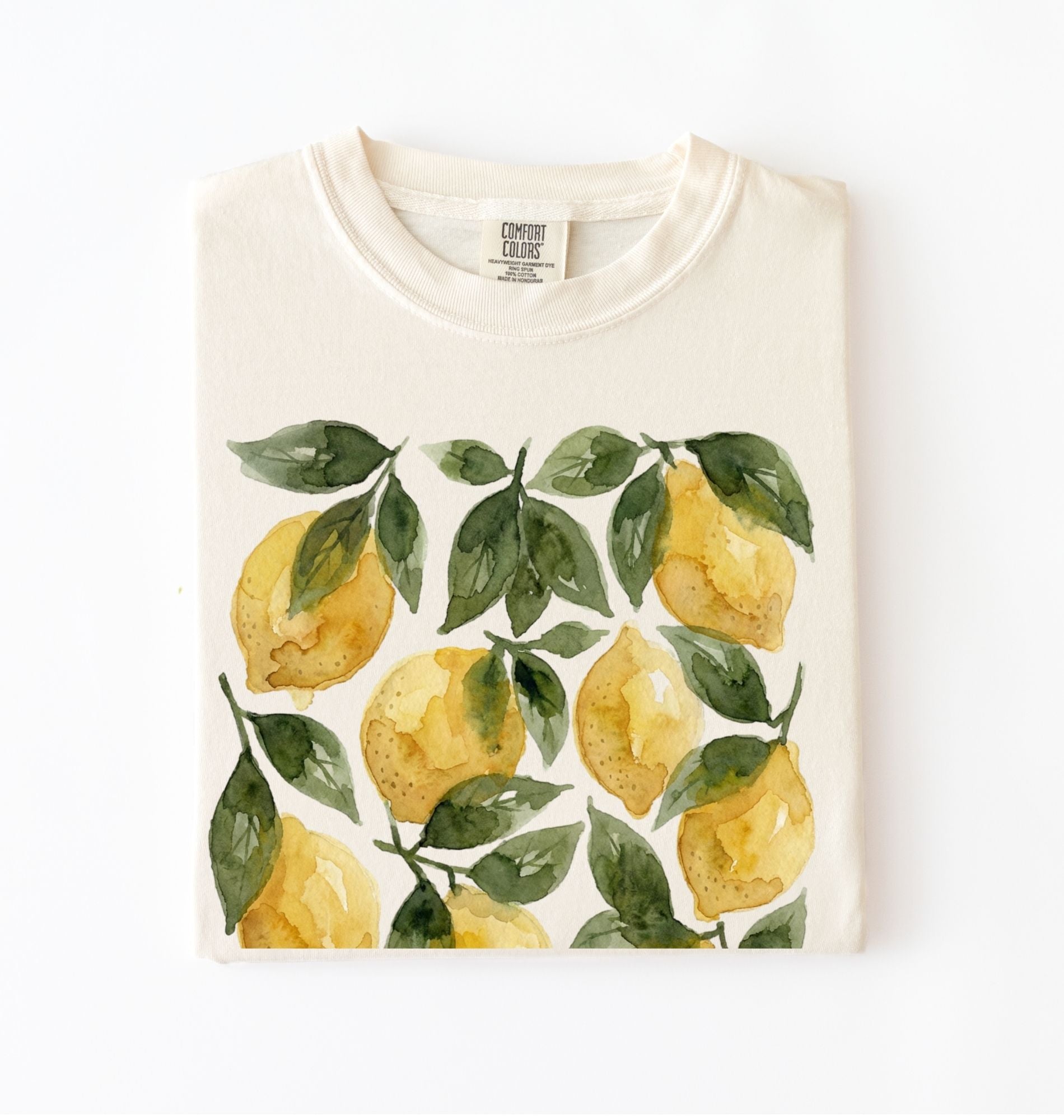 Ivory t-shirt with watercolor lemon and green leaf pattern, cottagecore style gardener gift tee