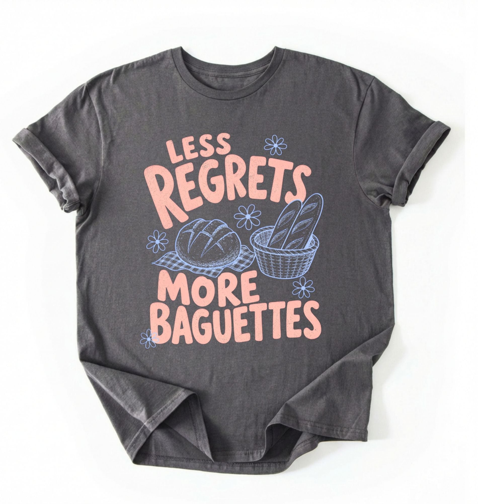 Flat lay of a charcoal less regrets more baguettes shirt brown funny baking t shirt bread lover gift foodie humor design on a white background 