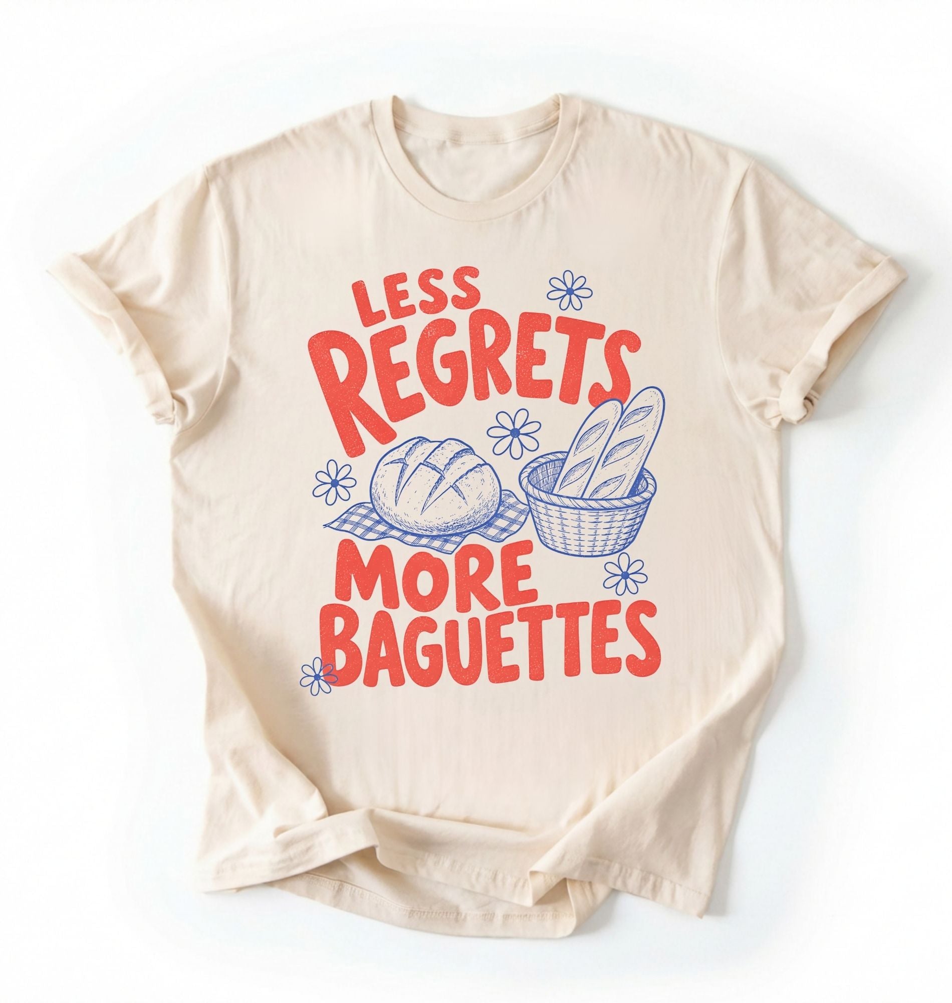Flat lay of a ivory less regrets more baguettes shirt brown funny baking t shirt bread lover gift foodie humor design on a white background 