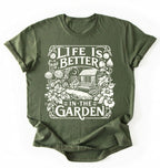 Flat lay of a moss shirt written Life is better in the garden cottagecore t-shirt with vintage floral garden illustration, perfect gardener gift on a white background 