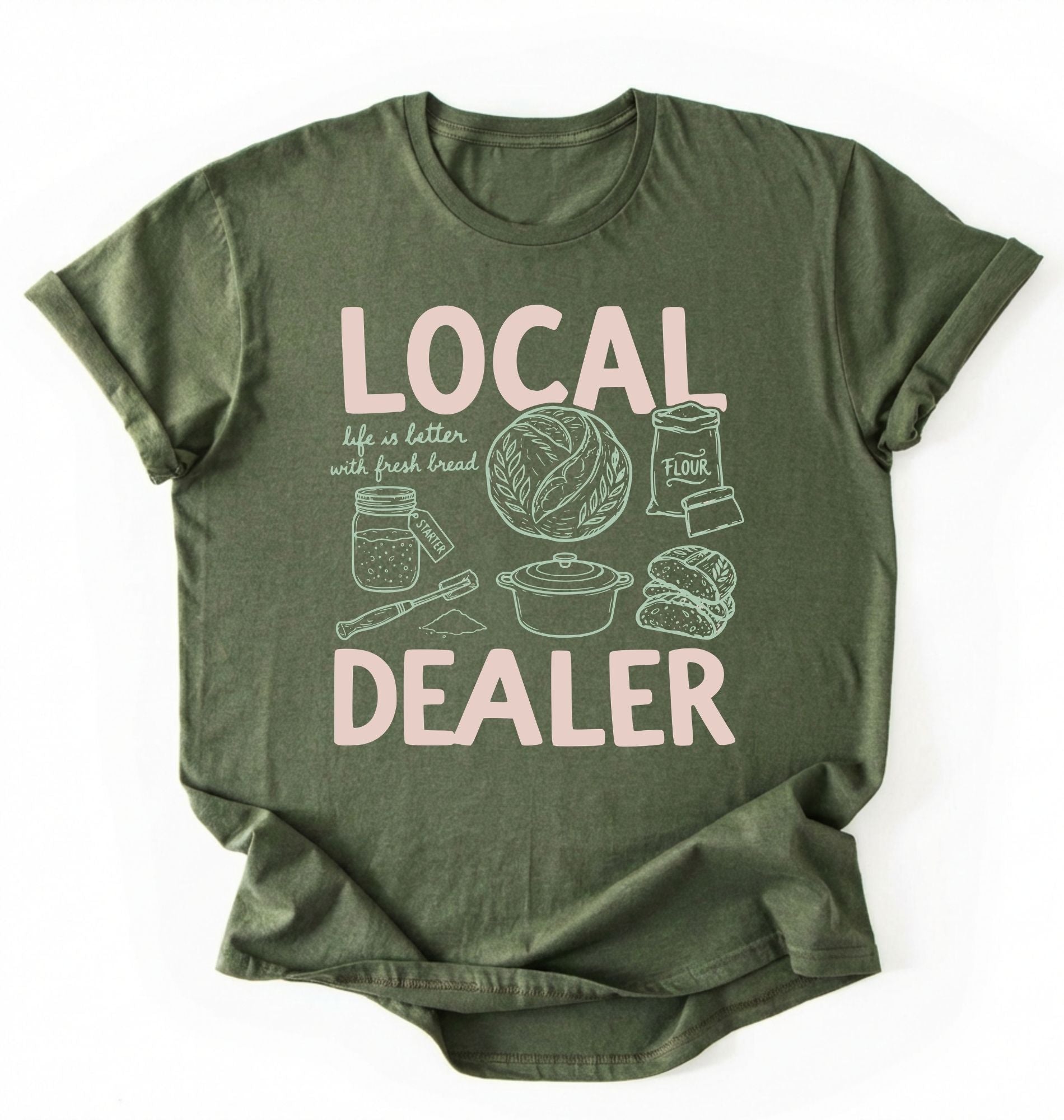 Flat lay of a Moss_MilitaryGreen Funny local dealer bread shirt with baking tools and sourdough theme perfect gift for bakers and bread lovers on a white background 