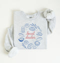 Flat lay of an ash Bakery themed crewneck featuring bread and sourdough starter graphics on a white background 