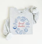 Flat lay of an ash Bakery themed crewneck featuring bread and sourdough starter graphics on a white background 