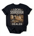 Flat lay of a black local sourdough dealer shirt black funny baking t shirt bread lover gift vintage bakery style on a white background 