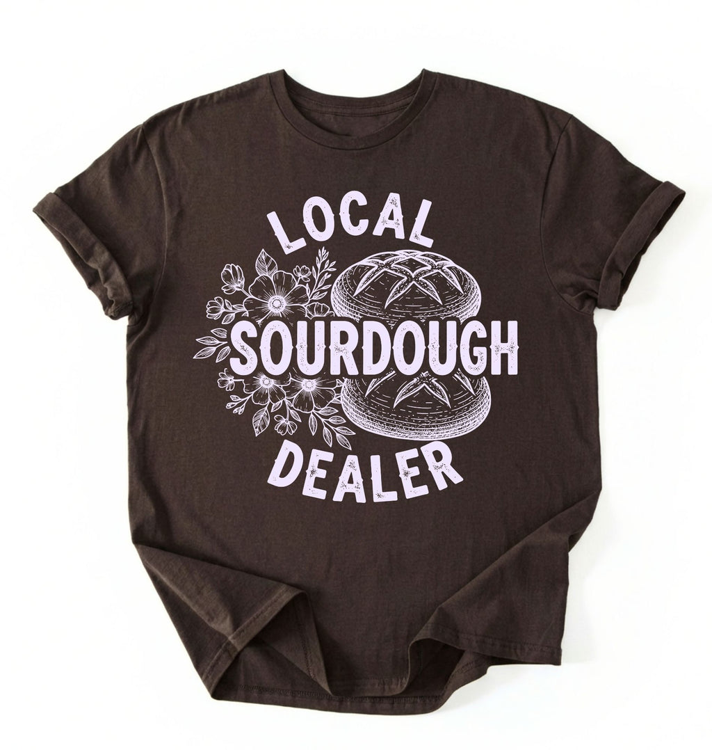 Flat lay of a dark chocolate local sourdough dealer shirt brown funny baking t shirt bread lover gift bakery humor on a white background 