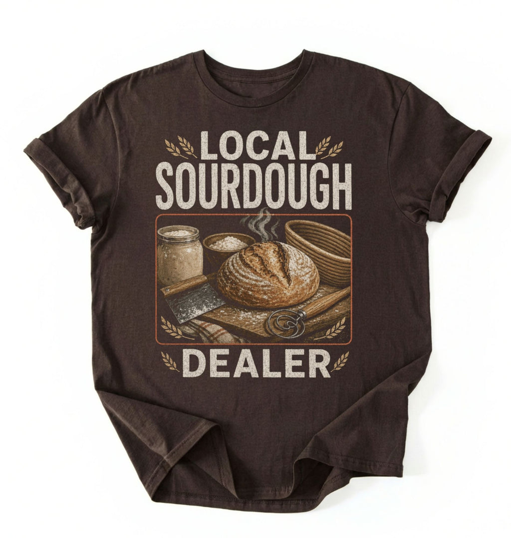 Flat lay of a dark chocolate local sourdough dealer shirt black funny baking t shirt bread lover gift vintage bakery style on a white background 