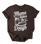 Flay lay of a dark chocolate Mama makes the dough shirt with bread and jar illustration funny baking mom gift white t-shirt on a white background