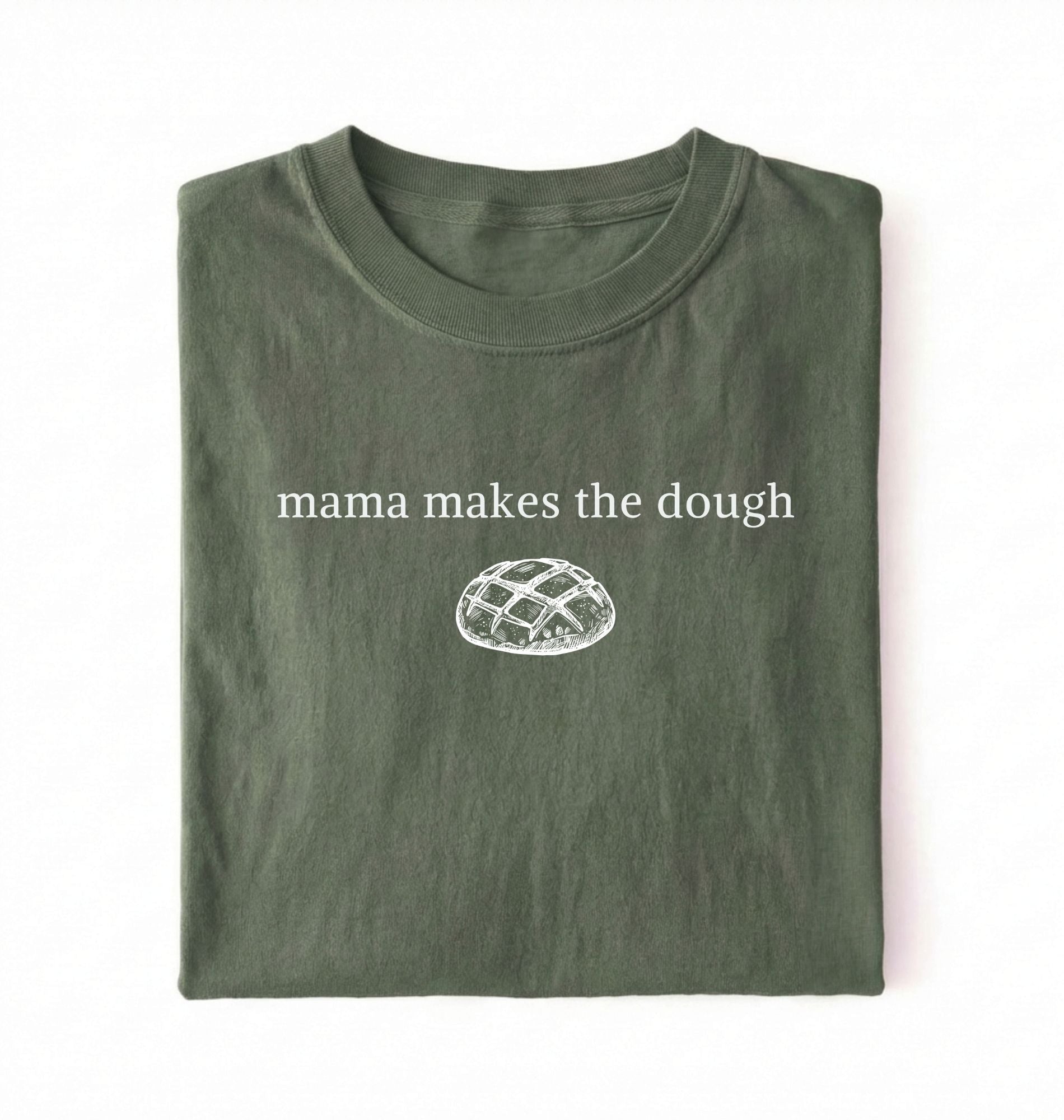 Flat lay of a military green Funny Mama Makes The Dough shirt with bread graphic on brown tee on a white background