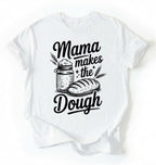 Flay lay of a white Mama makes the dough shirt with bread and jar illustration funny baking mom gift white t-shirt on a white background