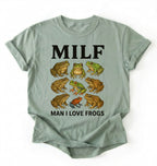 Flat lay of a bay Funny MILF frog shirt with illustrated frogs and Man I Love Frogs text graphic tee on a white background 