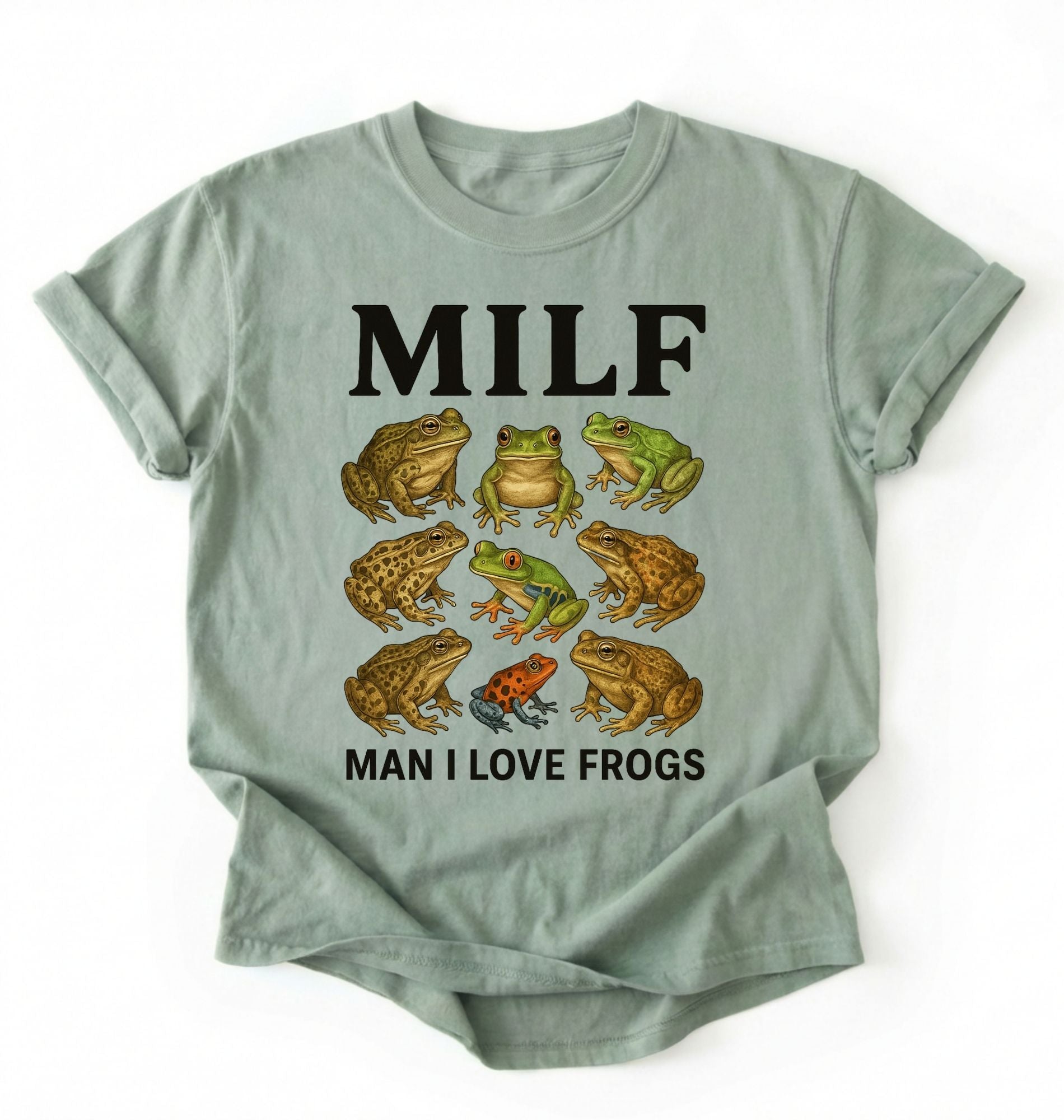 Flat lay of a bay Funny MILF frog shirt with illustrated frogs and Man I Love Frogs text graphic tee on a white background 