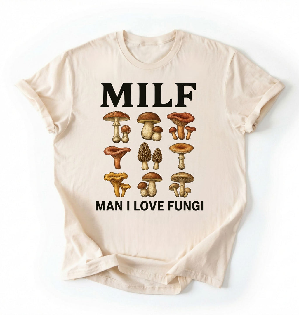 Flat lay of an ivory Natural Funny MILF mushroom shirt with illustrated fungi design gardener gift tee on a white background 