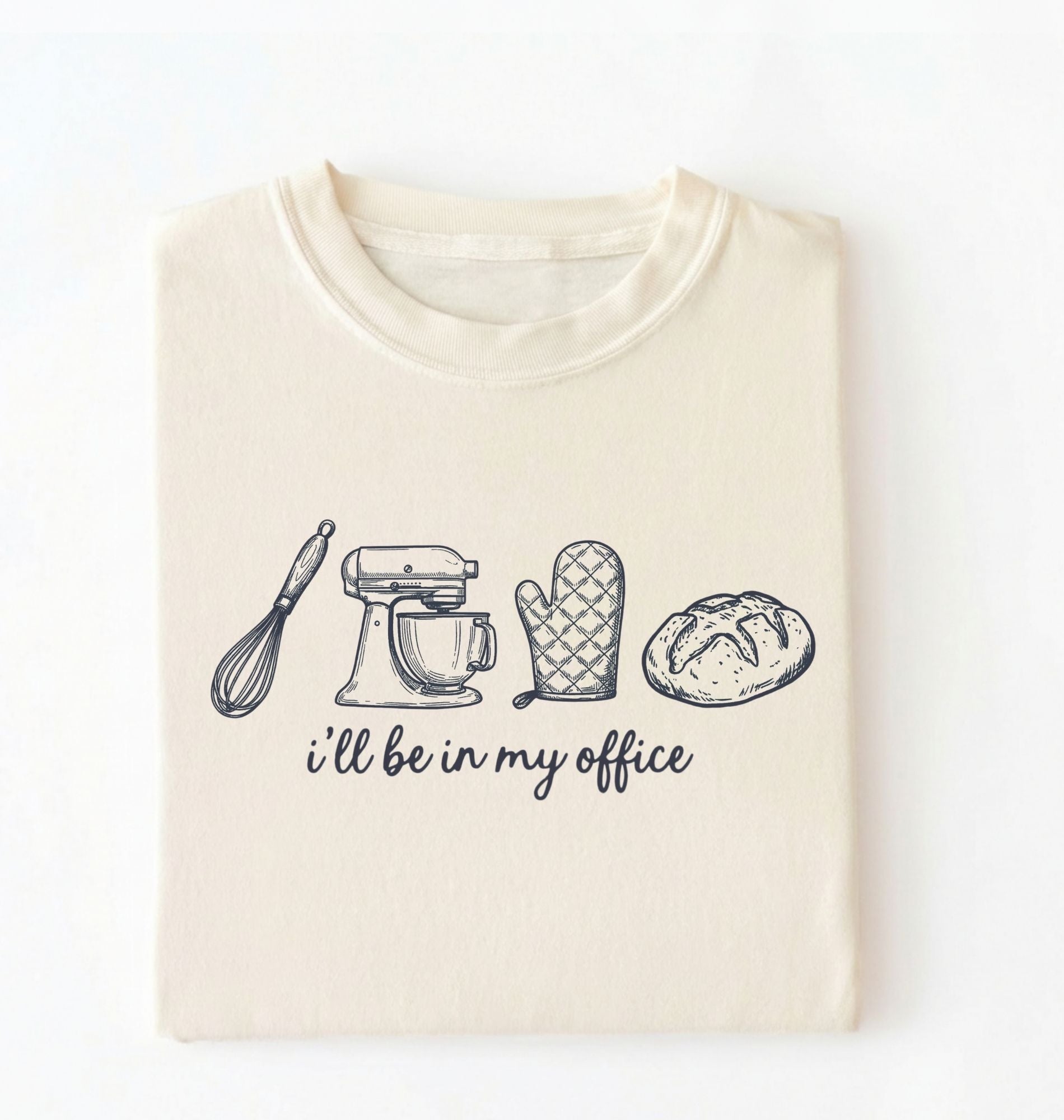Flat lay of an ivory Minimalist baking shirt with kitchen tools line art and ill be in my office text perfect gift for bakers on a white background 