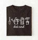 Flat lay of a dark chocolate Minimalist dirt nerd shirt with garden tools design perfect gift for plant lovers and gardeners on a white background