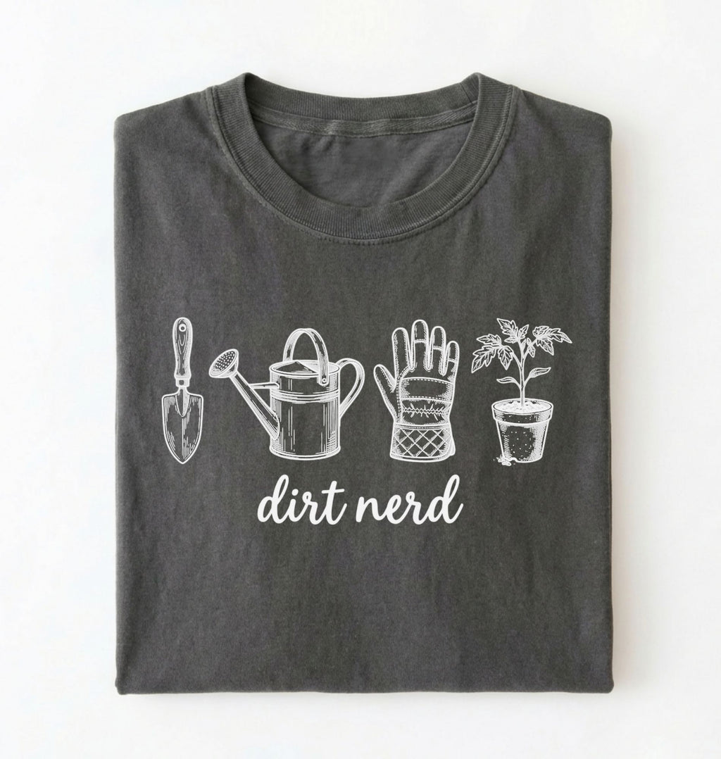 Flat lay of a pepper Minimalist dirt nerd shirt with garden tools design perfect gift for plant lovers and gardeners on a white background