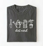 Flat lay of a pepper Minimalist dirt nerd shirt with garden tools design perfect gift for plant lovers and gardeners on a white background