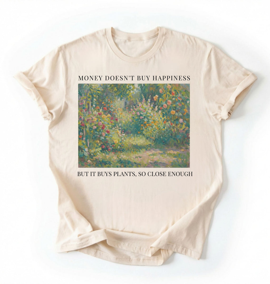 Flat lay ivory shirt Money doesn’t buy happiness but it buys plants t-shirt, funny quote tee for plant lovers on a white background