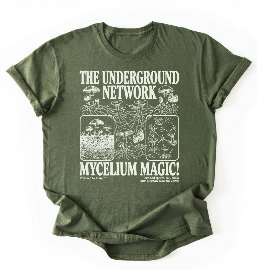 Flat lay of a MilitaryGreen t-shirt featuring Mycelium network mushroom and root network illustrations with text reading “The Underground Network Mycelium Magic” with forest fungi design perfect gift for mushroom lovers nature fans and cottagecore style on a white background 