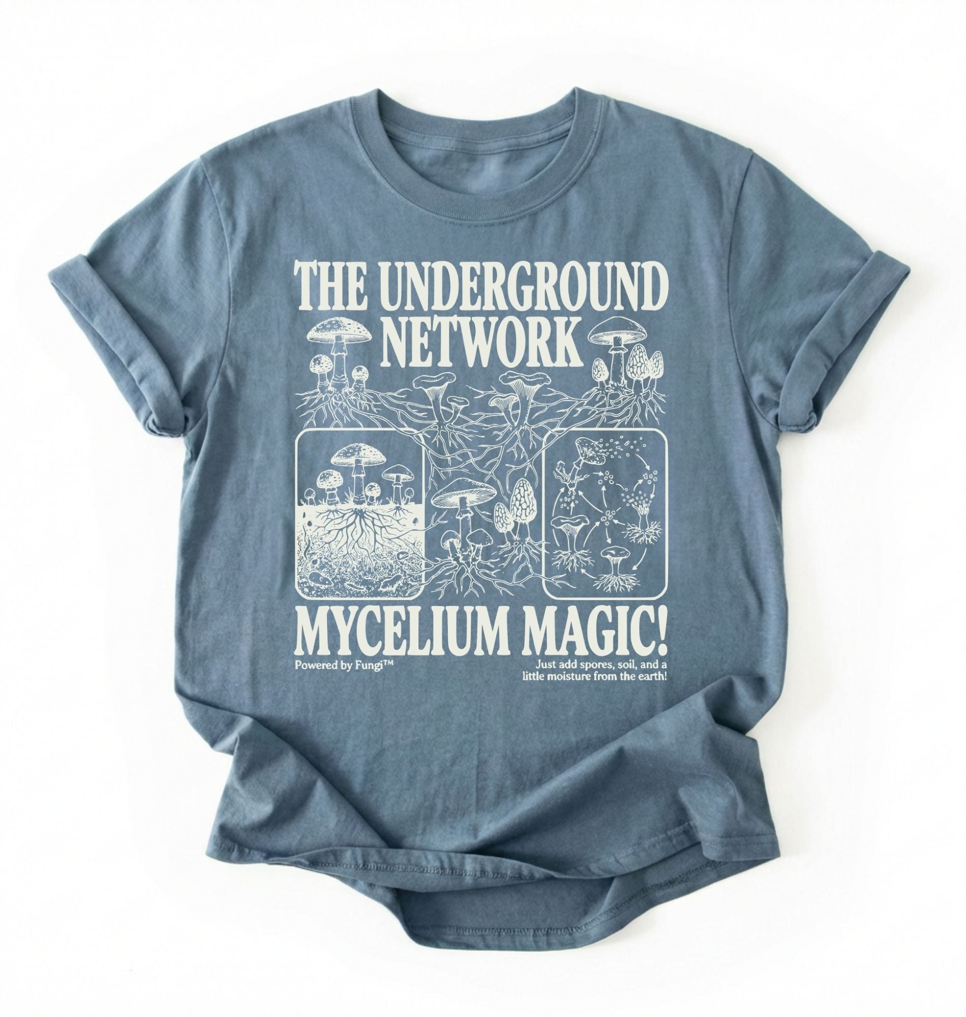 Flat lay of a stoneblue t-shirt featuring Mycelium network mushroom and root network illustrations with text reading “The Underground Network Mycelium Magic” with forest fungi design perfect gift for mushroom lovers nature fans and cottagecore style on a white background 