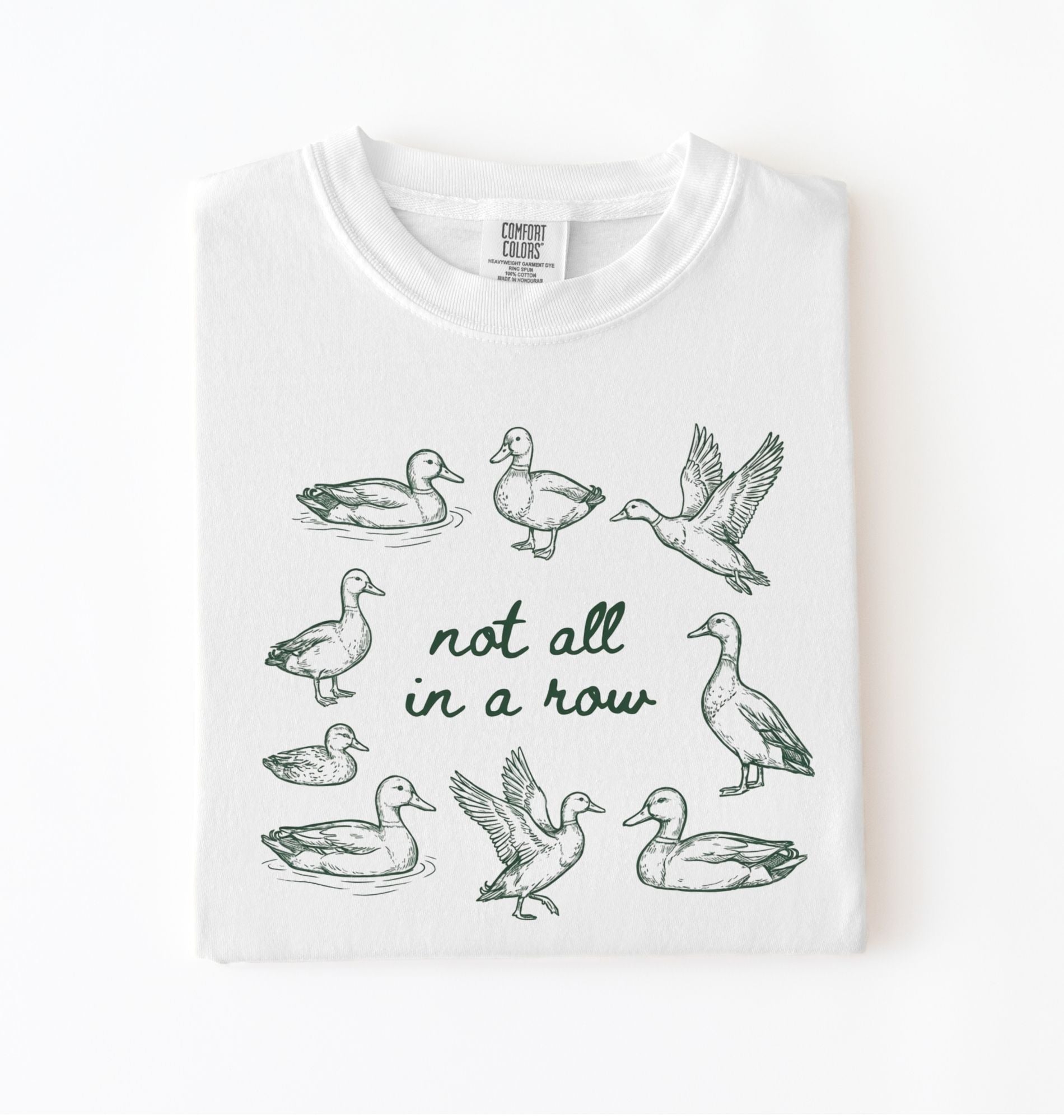 White duck graphic t-shirt with hand drawn ducks and not all in a row text, funny animal shirt gift
