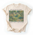 Flat lay of a ivory shirt written Now you’re just some garden t-shirt with funny gardening pun, perfect gardener gift on a white background