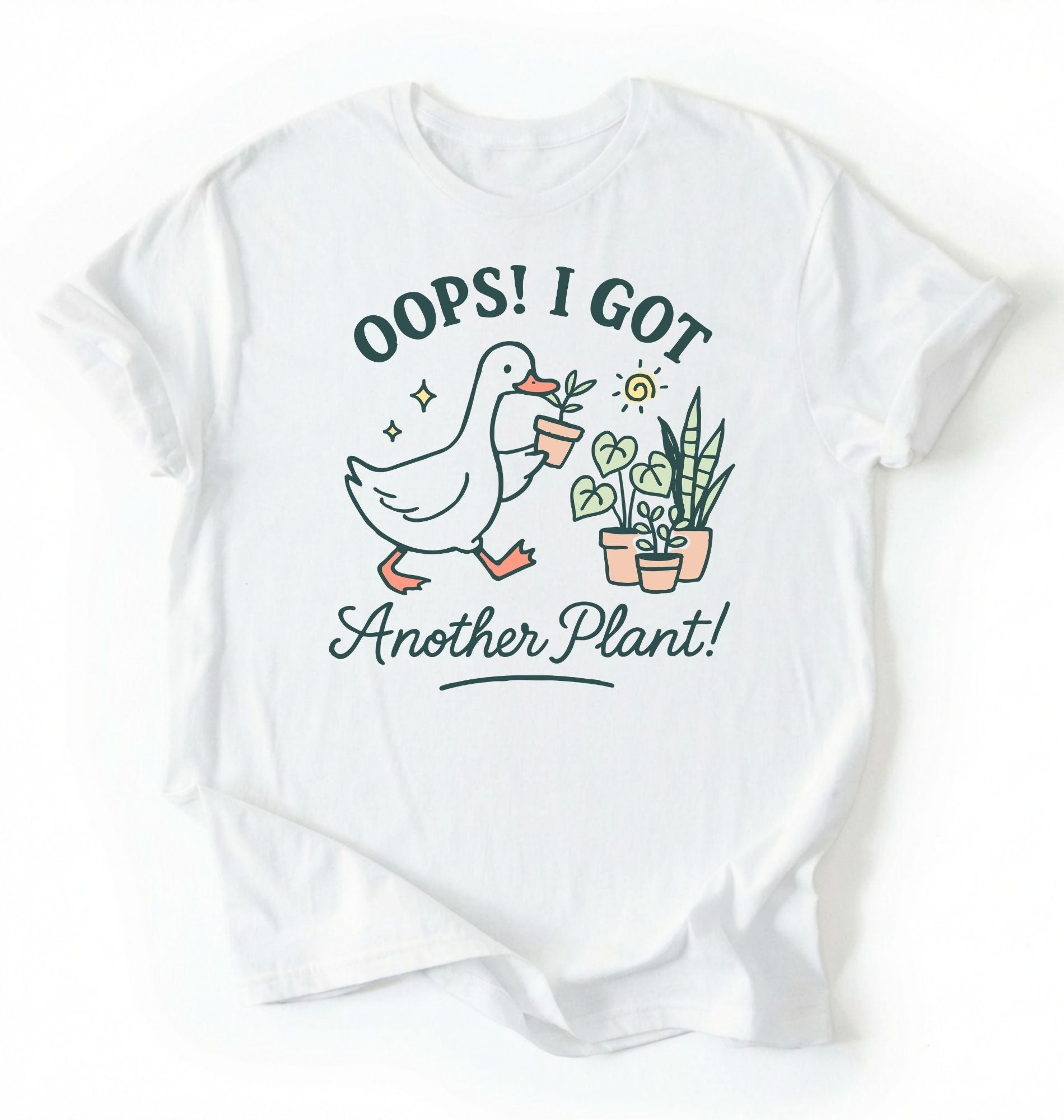 Flat lay white t-shirt with a graphic of a duck holding a plant and text 'Oops! I got another plant!' on a white background
