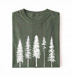 Flat lay of an moss t-shirt with white pine tree forest graphic, minimalist nature design for hiking and outdoor lovers on a white background