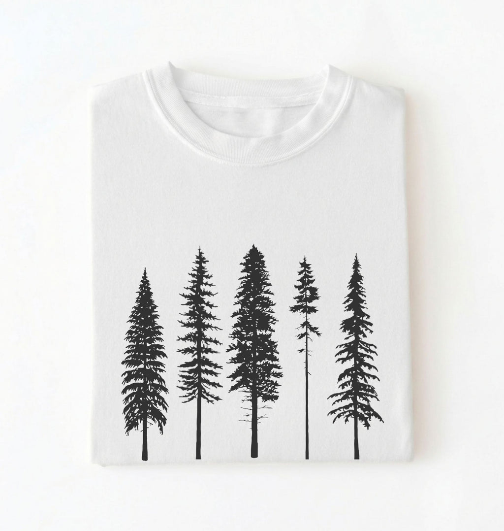 Flat lay of a white t-shirt with white pine tree forest graphic, minimalist nature design for hiking and outdoor lovers on a white background 