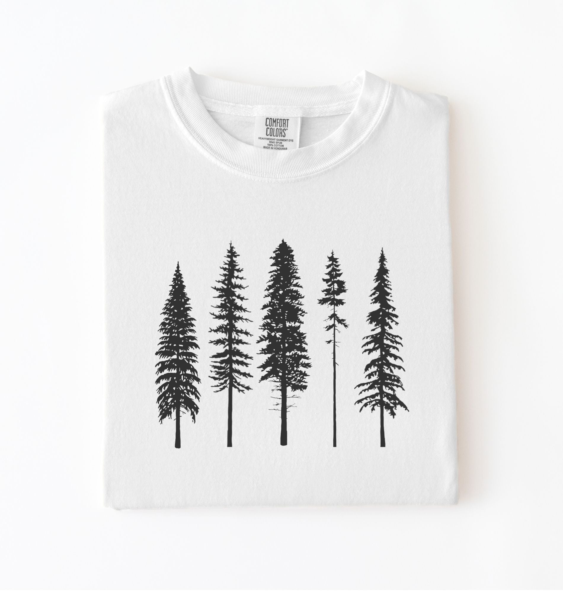 White t-shirt with black pine tree forest graphic, minimalist nature design for hiking and outdoor lovers