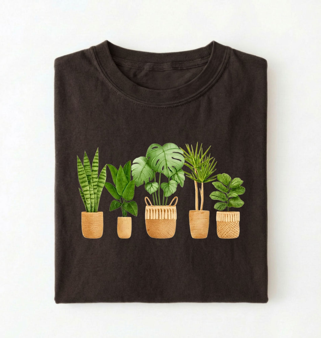 Flat lay of a dark_chocolate Houseplant lineup t-shirt with illustrated potted plants, cozy ivory tee, perfect gift for plant lovers on a white background 
