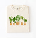 Houseplant lineup t-shirt with illustrated potted plants, cozy ivory tee, perfect gift for plant lovers