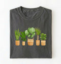 flat lay of a pepper Houseplant lineup t-shirt with illustrated potted plants, cozy pepper tee, perfect gift for plant lovers on a white background 
