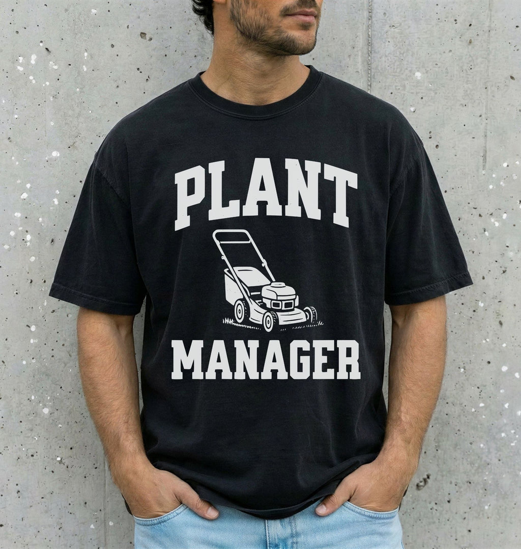 man wearing a black shirt that says "plant manager" with a lawn mower icon