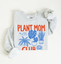 Flat lay of a ash green Plant mom club sweatshirt with houseplant illustrations perfect gift for plant lovers and indoor plant enthusiasts on a white background