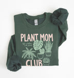 Flat lay of a forest green Plant mom club sweatshirt with houseplant illustrations perfect gift for plant lovers and indoor plant enthusiasts on a white background 