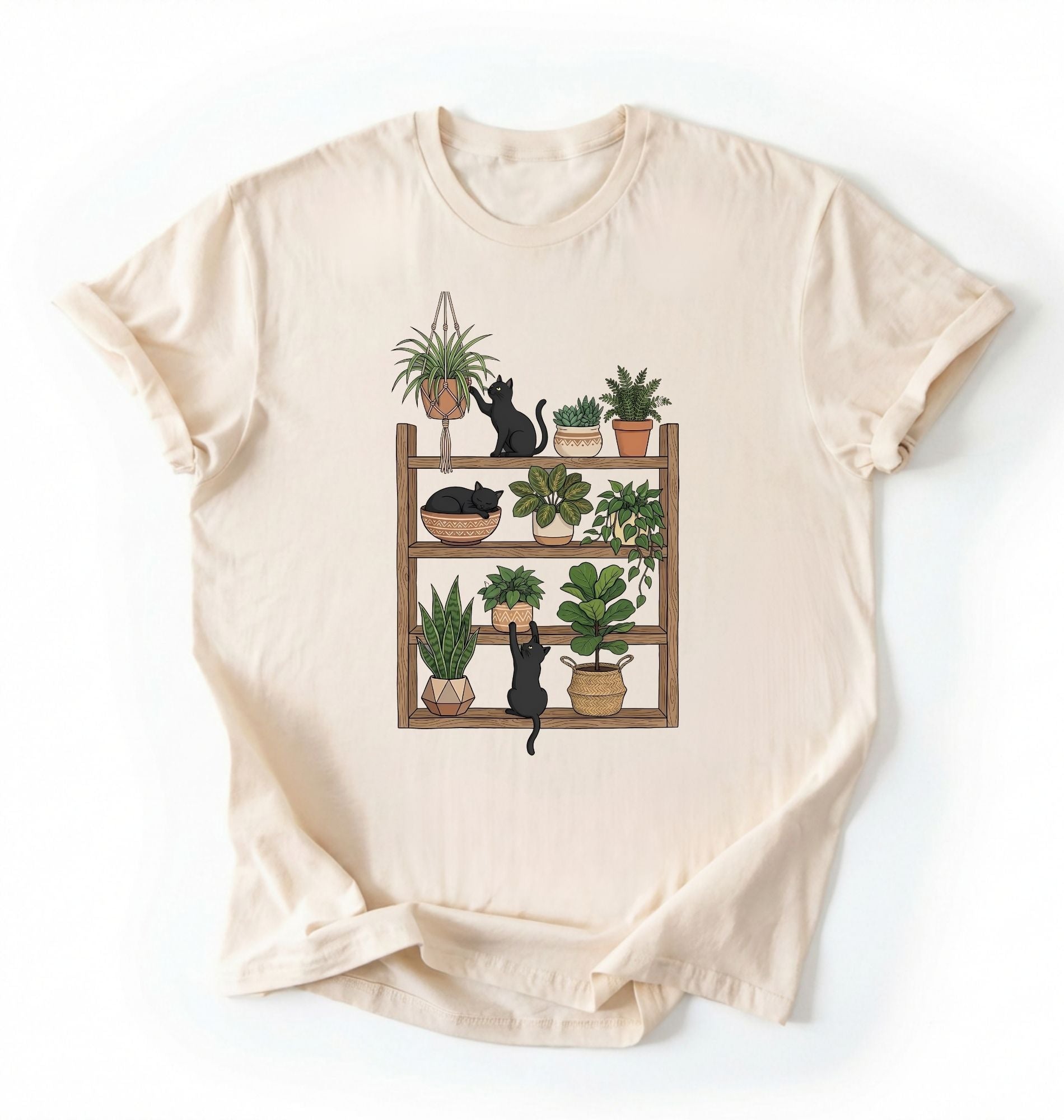 Flat lay of a Natural t-shirt featuring illustrated cats sitting and playing on a shelf of potted plants on a white background