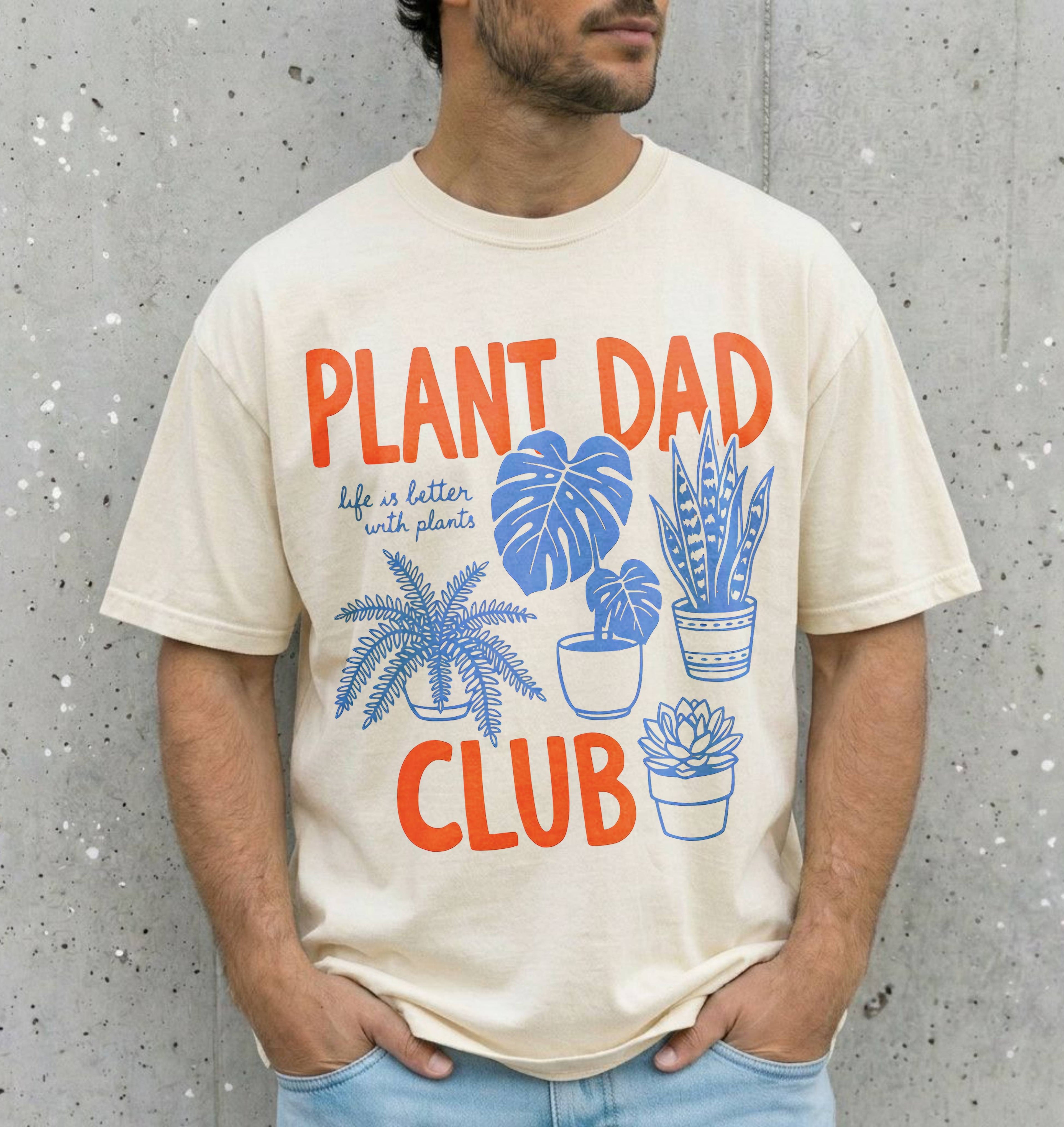 man wearing a natural colored shirt that says "plant dad club"