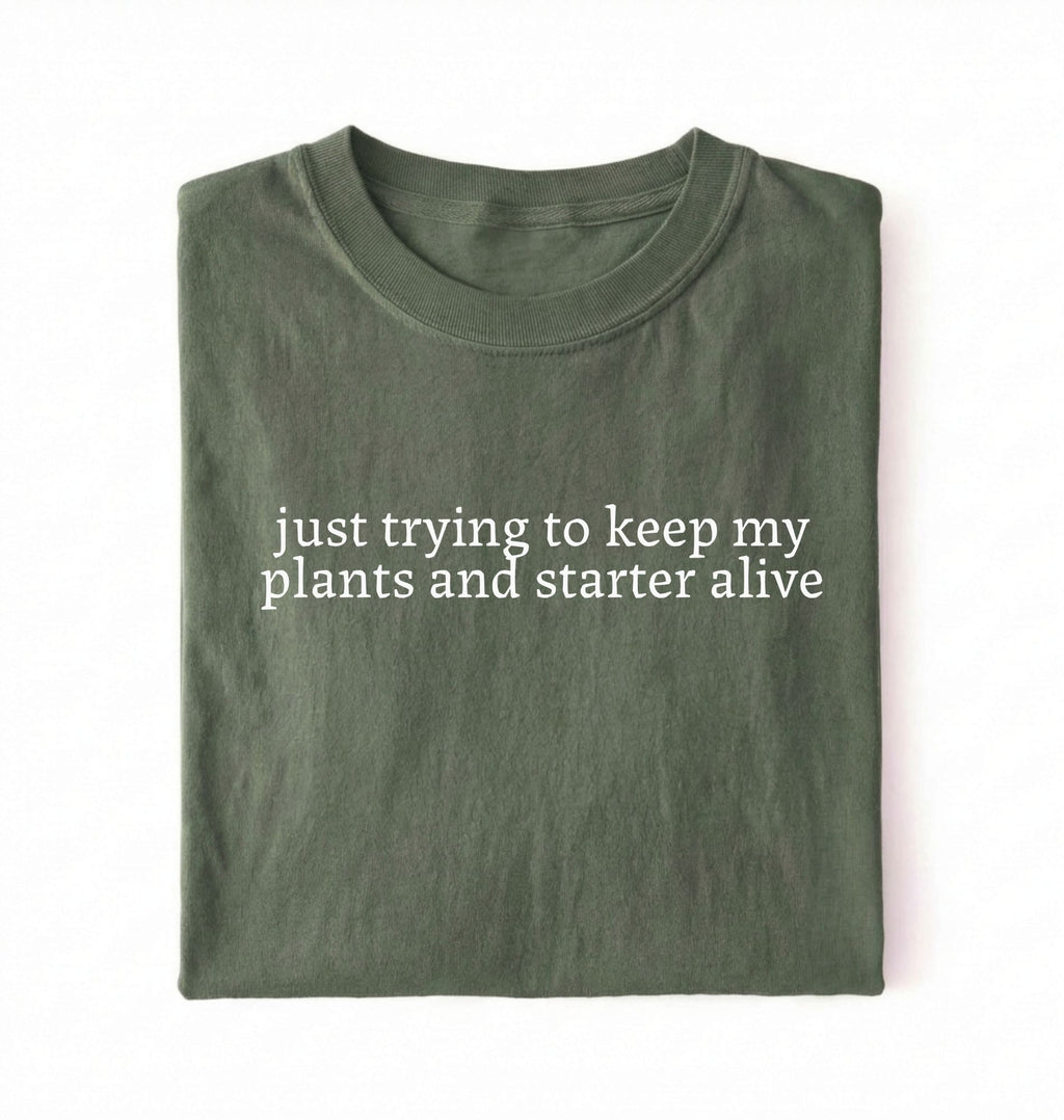 Flat lay of a green plants and sourdough starter shirt white funny minimalist plant lover baking t shirt gift on a whiter 
