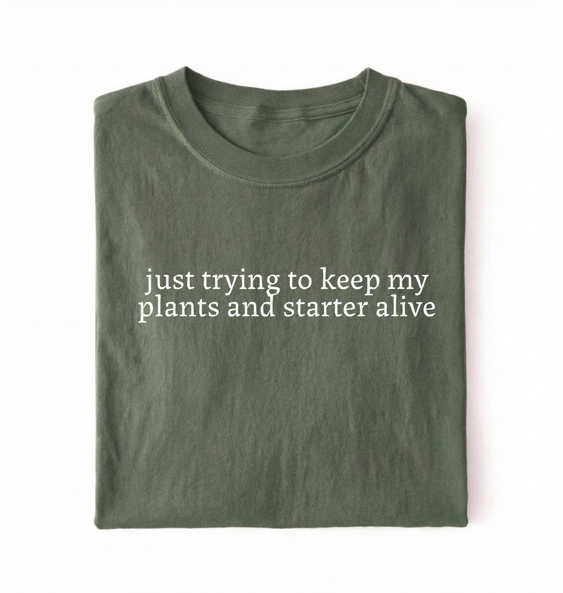 Flat lay of a green plants and sourdough starter shirt white funny minimalist plant lover baking t shirt gift on a whiter 