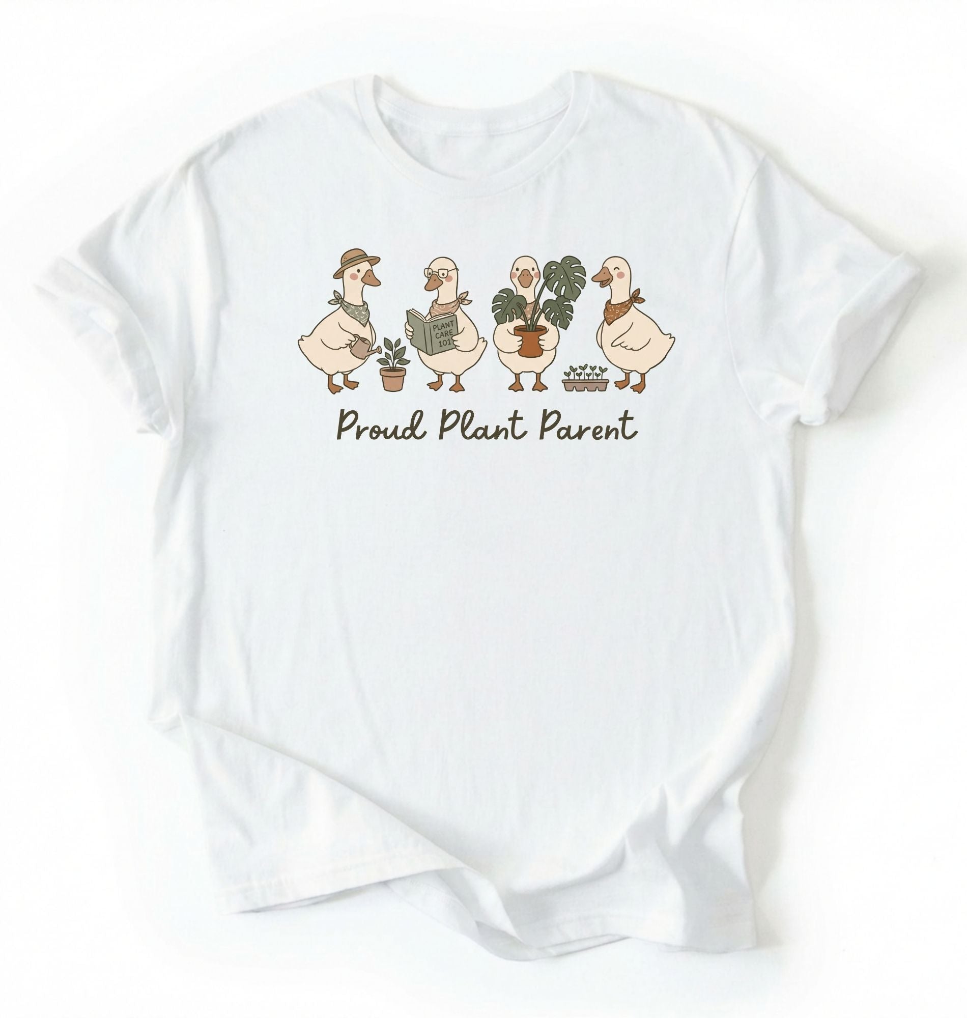 Flat lay white t-shirt with text reading 'Proud Plant Parent' featuring illustrated ducks on a white background