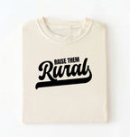 Flat lay of a Raise Them cream country graphic shirt on pepper tee for farm families and rural lifestyle lovers on a white background 