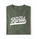 Flat lay of a Raise Them green country graphic shirt on pepper tee for farm families and rural lifestyle lovers on a white background 