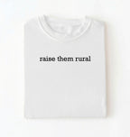 Flat lay of a Raise Them Rural country graphic shirt in white for farm families rural lifestyle and country living on a white background