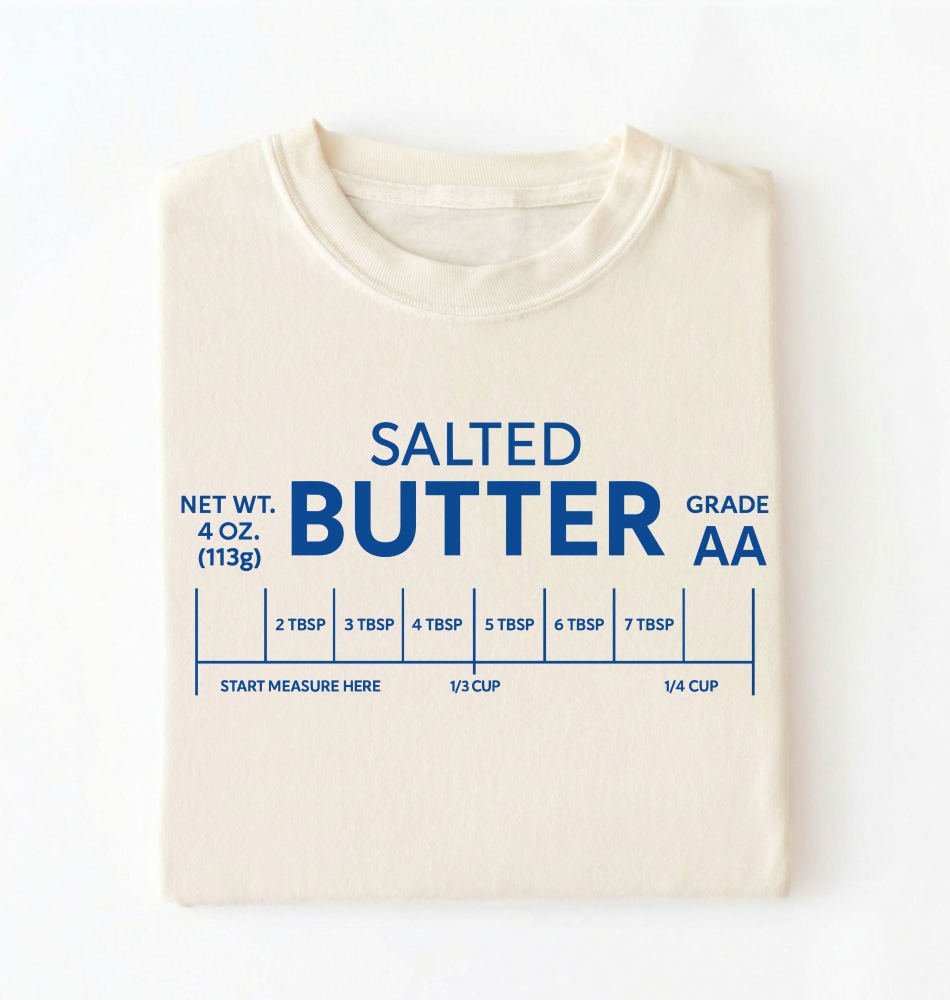 Flat lay of a ivory salted butter shirt funny baking t shirt foodie baker aesthetic gift on a white background 